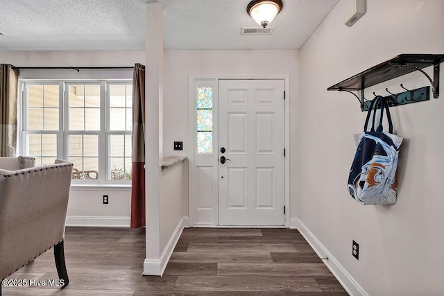 648 Pine Branches Cir SE, Leland, NC 28451 - foyer entrance with a textured ceiling and dark wood-style floors