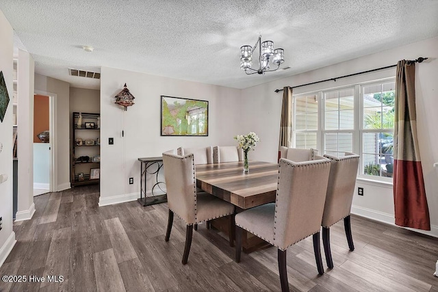 648 Pine Branches Cir SE, Leland, NC 28451 - dining room featuring wood finished floors, a chandelier, and a textured ceiling