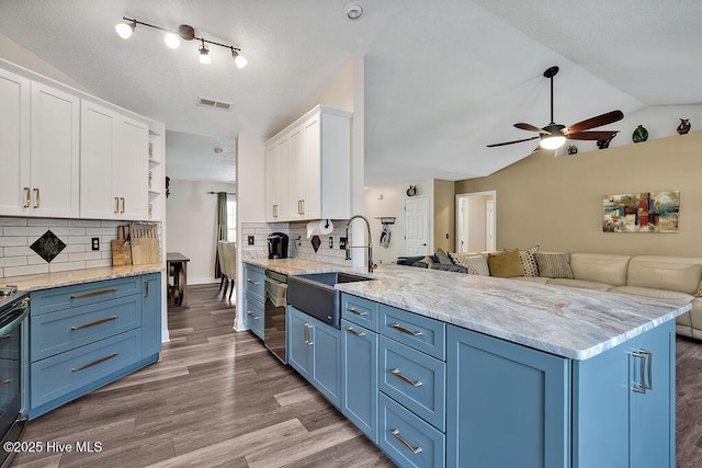 648 Pine Branches Cir SE, Leland, NC 28451 - kitchen with blue cabinetry, a peninsula, open shelves, white cabinetry, and ceiling fan