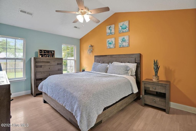 648 Pine Branches Cir SE, Leland, NC 28451 - bedroom featuring light wood-style flooring, lofted ceiling, and ceiling fan