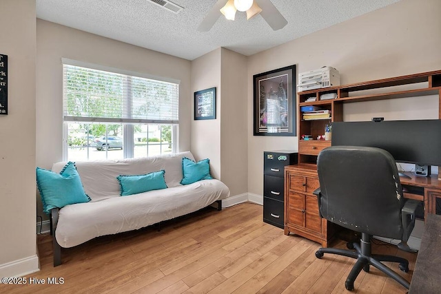 648 Pine Branches Cir SE, Leland, NC 28451 - office area with light wood-style floors, a textured ceiling, and a ceiling fan
