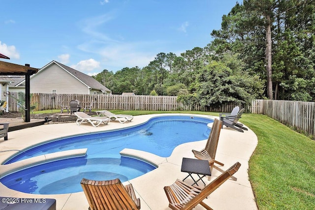 648 Pine Branches Cir SE, Leland, NC 28451 - view of pool featuring a patio, a fenced backyard, and a pool with connected hot tub