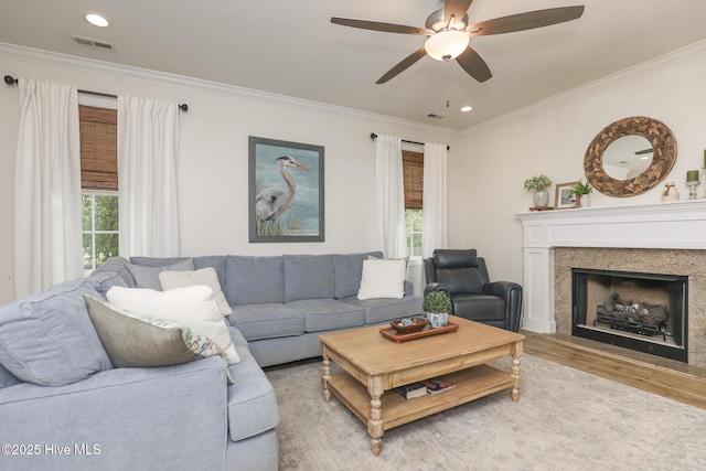 637 White Oak Xing, Swansboro, NC 28584 - living area featuring wood finished floors, ornamental molding, a ceiling fan, plenty of natural light, and recessed lighting