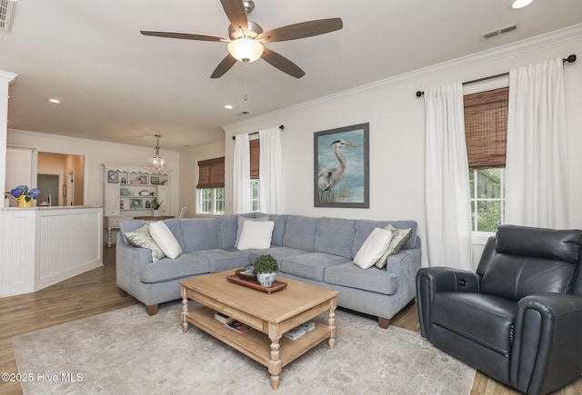 637 White Oak Xing, Swansboro, NC 28584 - living area with ornamental molding, light wood-style floors, a ceiling fan, and recessed lighting