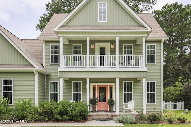 637 White Oak Xing, Swansboro, NC 28584 - view of front of home featuring a porch, board and batten siding, a balcony, and a shingled roof