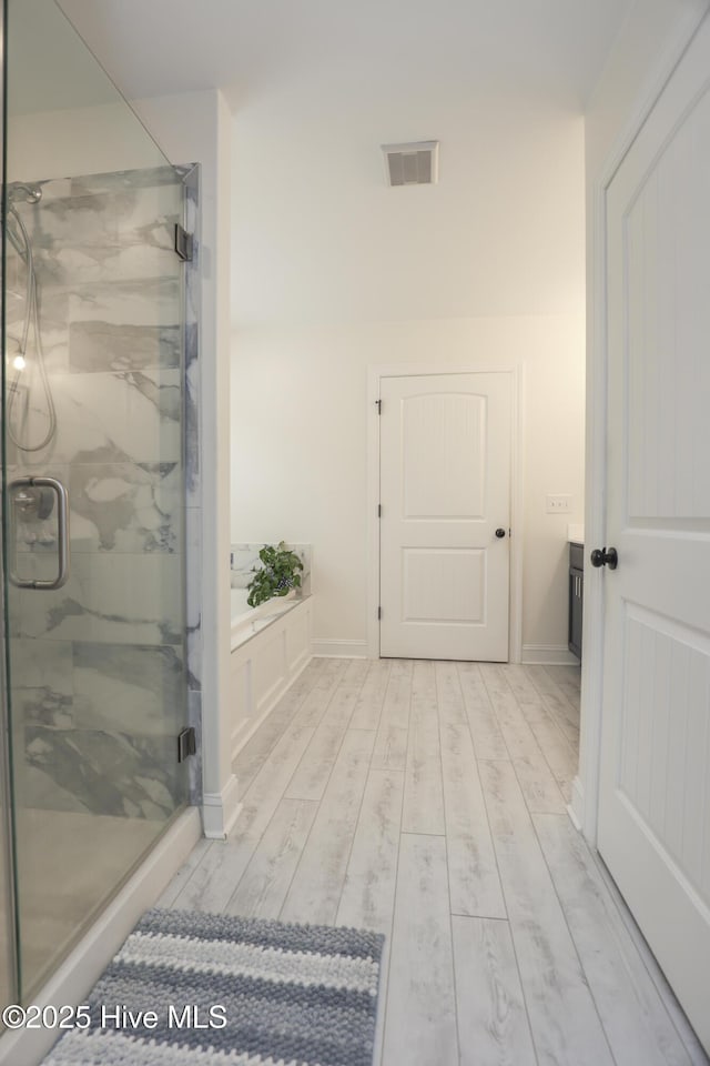 637 White Oak Xing, Swansboro, NC 28584 - full bath featuring a marble finish shower and wood finished floors