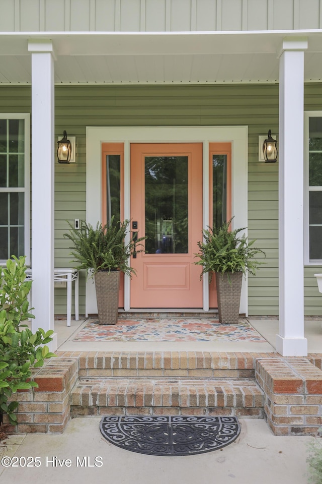 637 White Oak Xing, Swansboro, NC 28584 - doorway to property featuring a porch and board and batten siding