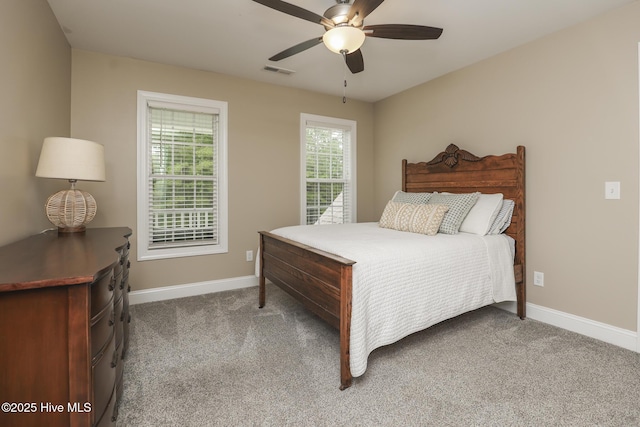637 White Oak Xing, Swansboro, NC 28584 - carpeted bedroom featuring baseboards and ceiling fan