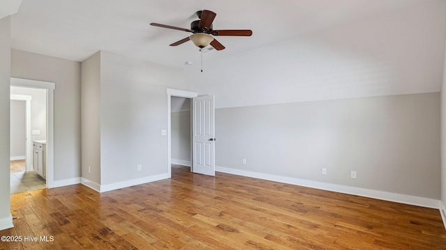 359 N Leak St, Southern Pines, NC 28387 - empty room with lofted ceiling, ceiling fan, light wood finished floors, and baseboards
