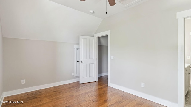 359 N Leak St, Southern Pines, NC 28387 - unfurnished room with a ceiling fan, light wood-style flooring, lofted ceiling, baseboards, and a smoke detector