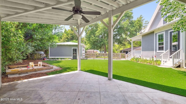 359 N Leak St, Southern Pines, NC 28387 - view of patio / terrace with a ceiling fan, an outdoor structure, and entry steps