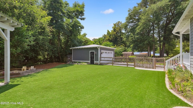 359 N Leak St, Southern Pines, NC 28387 - view of yard with a detached garage and an outbuilding