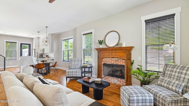 359 N Leak St, Southern Pines, NC 28387 - living room featuring baseboards, a fireplace, and wood finished floors