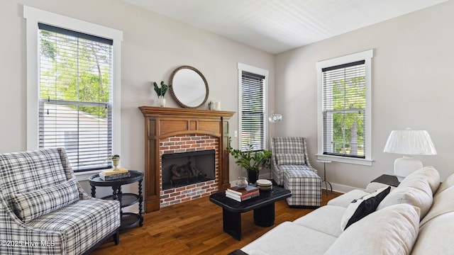 359 N Leak St, Southern Pines, NC 28387 - living area featuring a brick fireplace and dark wood-style flooring