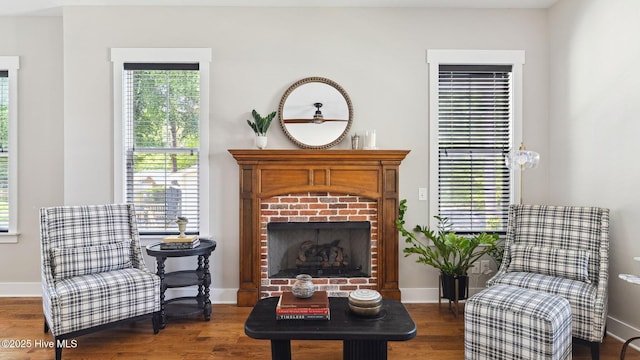 359 N Leak St, Southern Pines, NC 28387 - sitting room with a brick fireplace, baseboards, and wood finished floors
