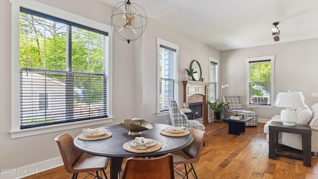 359 N Leak St, Southern Pines, NC 28387 - dining space featuring plenty of natural light, a brick fireplace, and baseboards