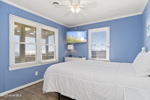 901 Ocean Dr, Emerald Isle, NC 28594 - bedroom with wood finished floors, ornamental molding, baseboards, and a ceiling fan