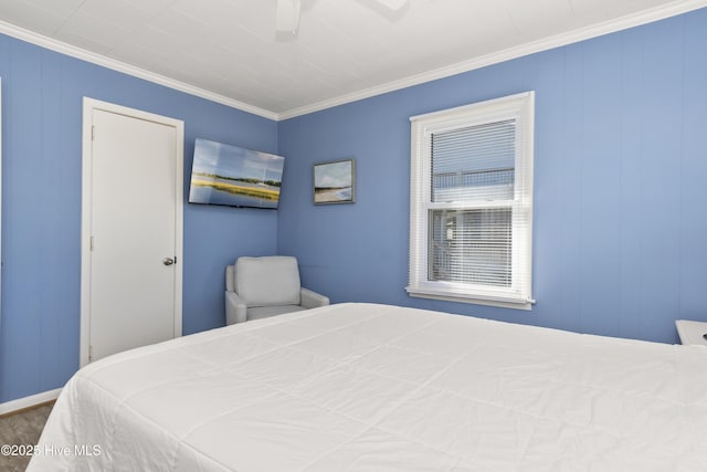 901 Ocean Dr, Emerald Isle, NC 28594 - bedroom featuring ornamental molding and ceiling fan