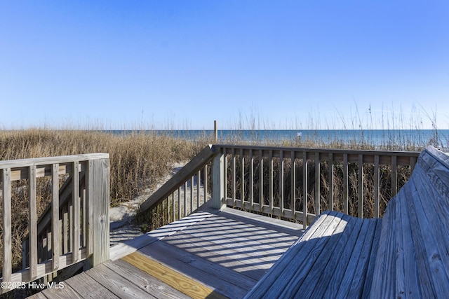 901 Ocean Dr, Emerald Isle, NC 28594 - wooden terrace featuring view of water and beach