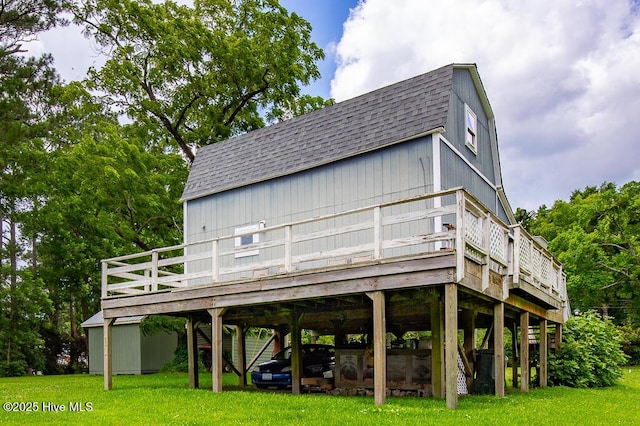 503 Vandemere Rd, Bayboro, NC 28515 - back of property featuring roof with shingles, a carport, a deck, and a yard