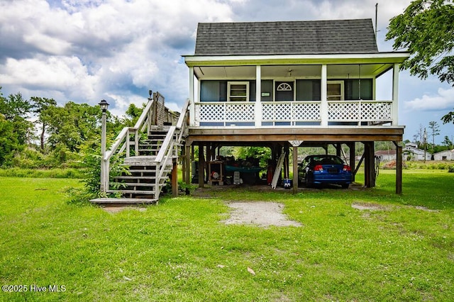 503 Vandemere Rd, Bayboro, NC 28515 - rear view of property with a carport, a shingled roof, a yard, and stairway