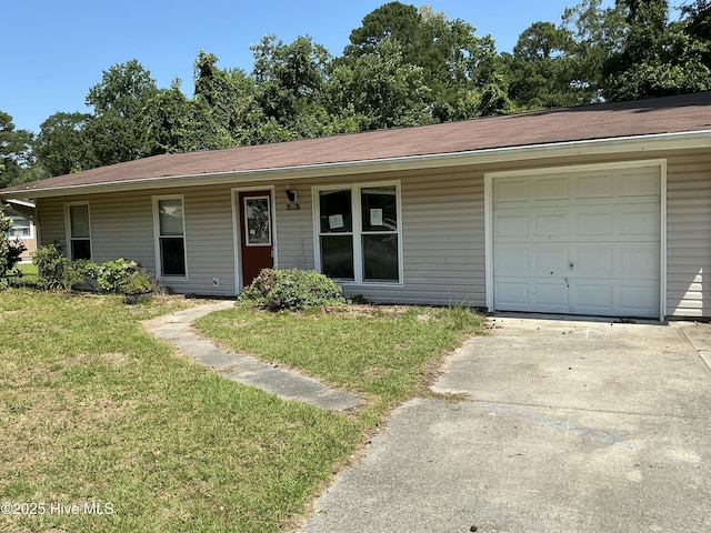 102 Tanglewood Dr, Jacksonville, NC 28540 - single story home with a front yard, driveway, and an attached garage
