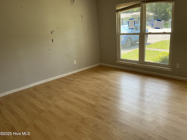 102 Tanglewood Dr, Jacksonville, NC 28540 - unfurnished room with baseboards and light wood-style floors