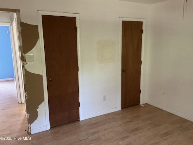 102 Tanglewood Dr, Jacksonville, NC 28540 - unfurnished bedroom featuring wood finished floors
