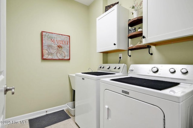 3853 Winding Vine Way, Southport, NC 28461 - laundry area featuring cabinet space, independent washer and dryer, and tile patterned floors