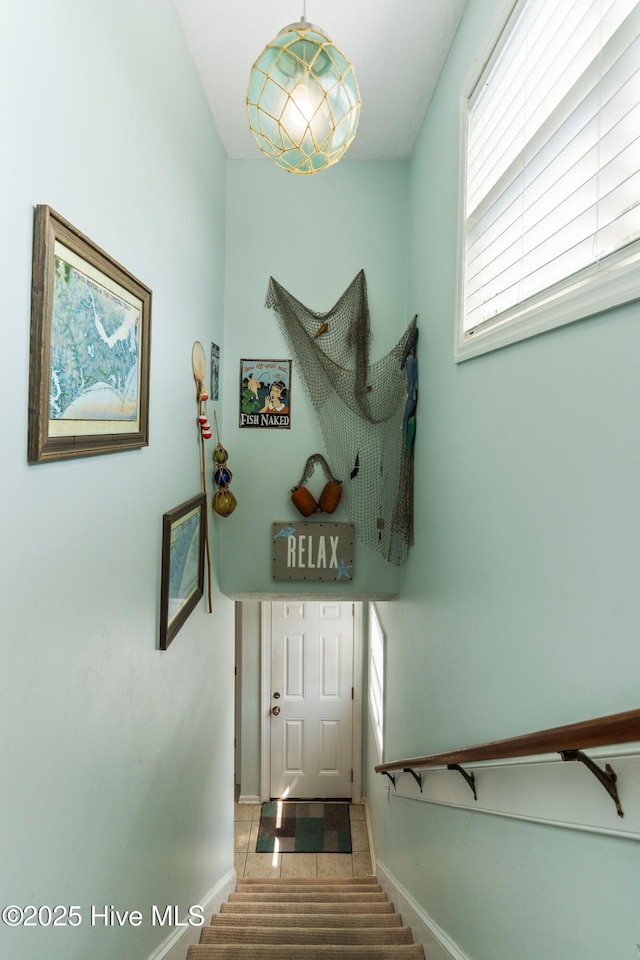 2310 New River Inlet Rd Unit 1, North Topsail Beach, NC 28460 - stairs featuring baseboards and tile patterned flooring