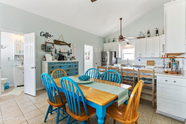 2310 New River Inlet Rd Unit 1, North Topsail Beach, NC 28460 - dining area featuring ceiling fan, light tile patterned floors, and high vaulted ceiling