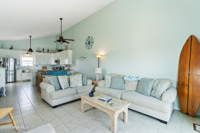 2310 New River Inlet Rd Unit 1, North Topsail Beach, NC 28460 - living room featuring vaulted ceiling, a ceiling fan, and light tile patterned floors