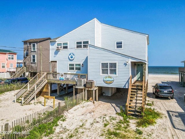 2310 New River Inlet Rd Unit 1, North Topsail Beach, NC 28460 - back of property featuring stairway and view of water and beach