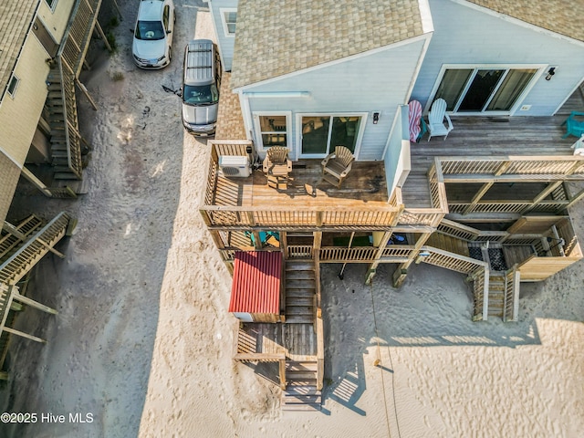 2310 New River Inlet Rd Unit 1, North Topsail Beach, NC 28460 - rear view of house with roof with shingles and a deck