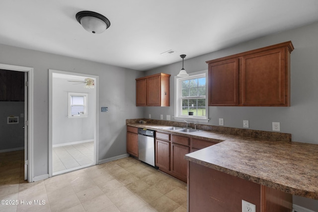 308 Big Tree Ln, Chinquapin, NC 28521 - kitchen featuring stainless steel dishwasher, dark countertops, decorative light fixtures, brown cabinets, and ceiling fan