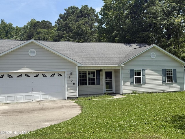 308 Big Tree Ln, Chinquapin, NC 28521 - ranch-style home featuring driveway, a shingled roof, and a front yard