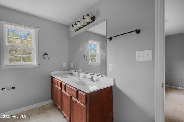 308 Big Tree Ln, Chinquapin, NC 28521 - bathroom featuring double vanity and baseboards