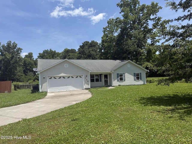 308 Big Tree Ln, Chinquapin, NC 28521 - ranch-style house featuring driveway, an attached garage, and view of wooded area
