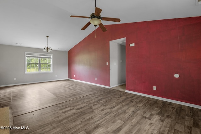 308 Big Tree Ln, Chinquapin, NC 28521 - spare room featuring wood finished floors, ceiling fan, a chandelier, and lofted ceiling