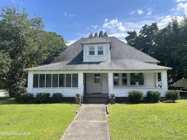 413 E Center St, Nashville, NC 27856 - bungalow featuring a front yard and roof with shingles