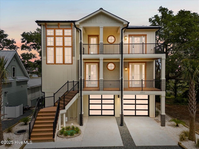 1711 Hemingway Dr SW, Ocean Isle Beach, NC 28469 - view of front of home with a balcony, stairs, french doors, and a porch