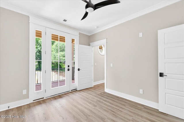 1711 Hemingway Dr SW, Ocean Isle Beach, NC 28469 - entrance foyer featuring ceiling fan, baseboards, wood finished floors, and ornamental molding