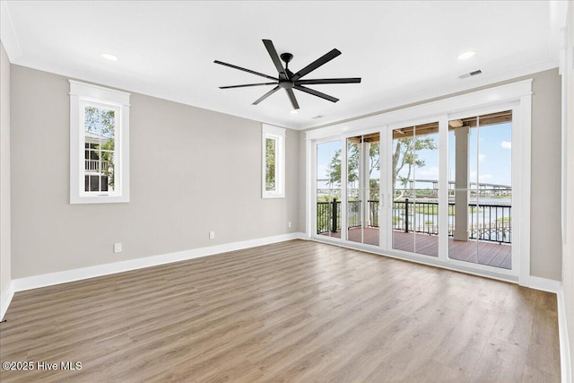 1711 Hemingway Dr SW, Ocean Isle Beach, NC 28469 - unfurnished room with ceiling fan, light wood-style floors, ornamental molding, baseboards, and recessed lighting