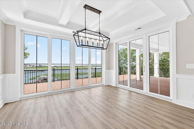 1711 Hemingway Dr SW, Ocean Isle Beach, NC 28469 - unfurnished sunroom with a water view, healthy amount of natural light, a chandelier, and beam ceiling