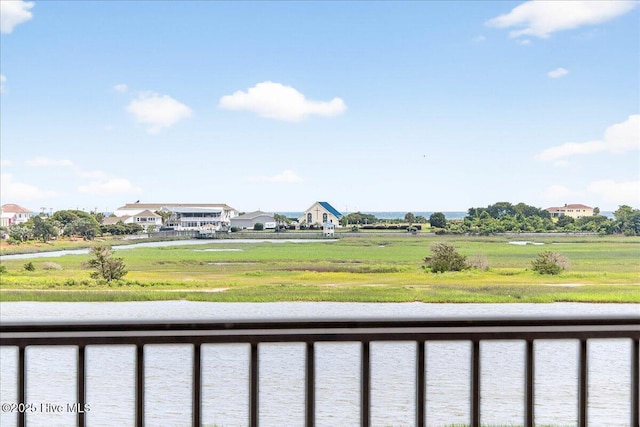 1711 Hemingway Dr SW, Ocean Isle Beach, NC 28469 - view of yard featuring a balcony and a water view