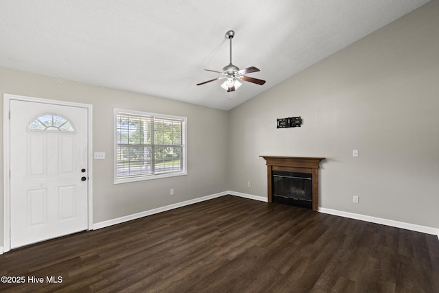 302 Josie Ct, Hubert, NC 28539 - unfurnished living room featuring a ceiling fan, dark wood-style floors, lofted ceiling, and a glass covered fireplace