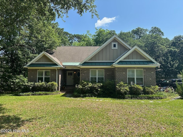 2790 Scotts Hill Loop Rd, Wilmington, NC 28411 - craftsman-style home featuring a front lawn, board and batten siding, and brick siding