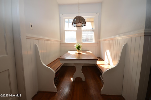 1409 E Walnut St, Goldsboro, NC 27530 - dining area featuring a wainscoted wall, breakfast area, and hardwood / wood-style floors