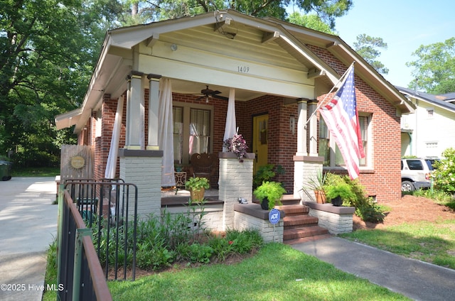 1409 E Walnut St, Goldsboro, NC 27530 - view of front of home with brick siding, a ceiling fan, and covered porch
