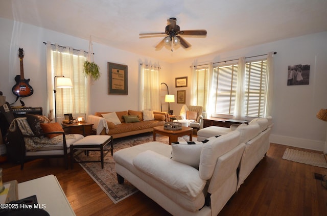 1409 E Walnut St, Goldsboro, NC 27530 - living room with a ceiling fan, dark wood-type flooring, and baseboards